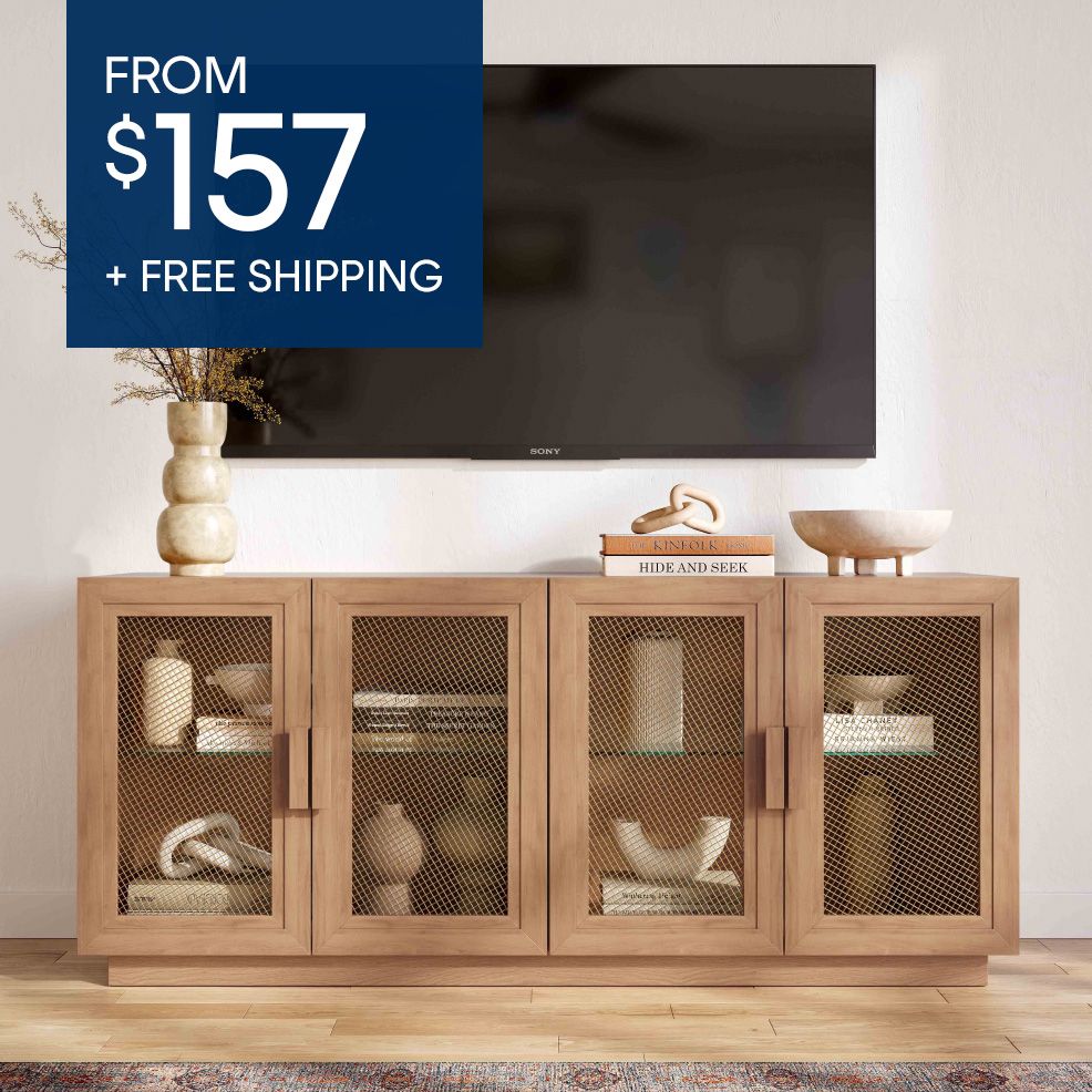 FROM $157 + FREE SHIPPING. A wooden TV stand with mesh doors.
