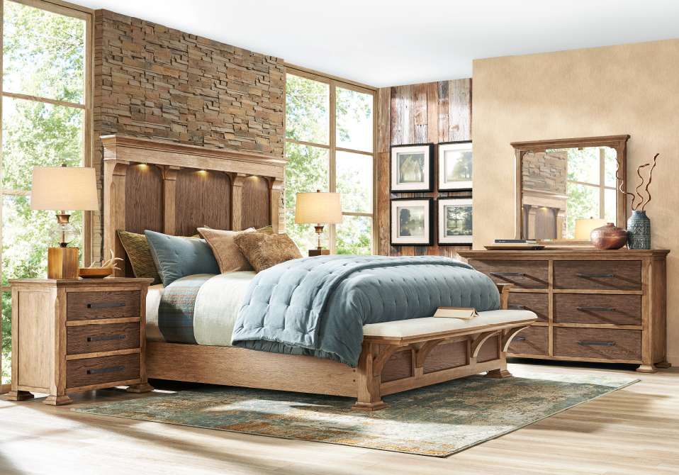 Bedroom furniture set with a bed, nightstand, dresser, and bench.
