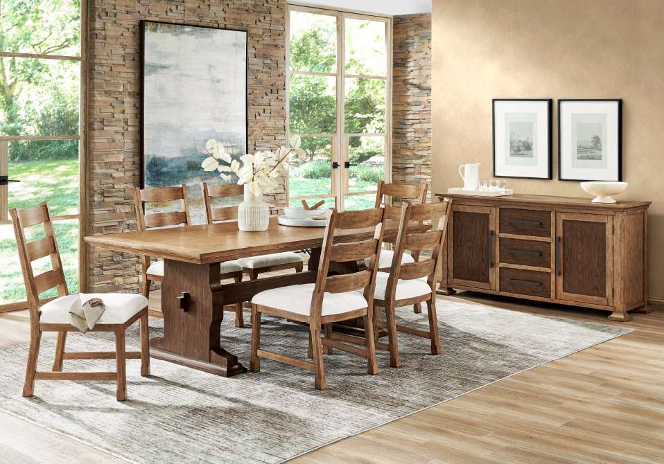 Dining room with a wooden table, chairs, and a sideboard.
