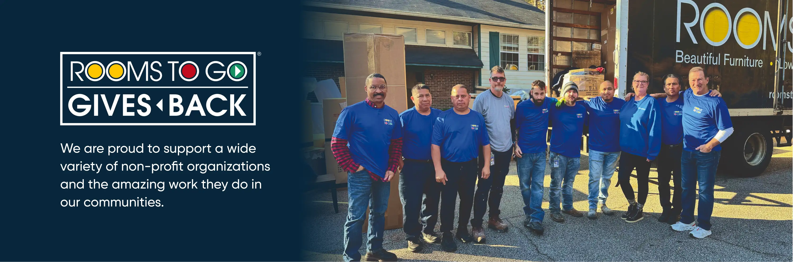 Rooms to Go Gives Back. Group of people in blue shirts standing in front of a truck.

