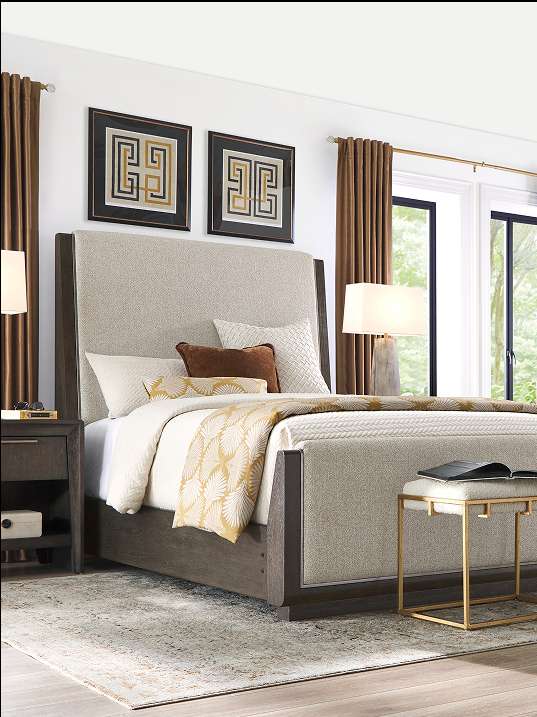Bedroom with a bed, nightstand, and decorative art.
