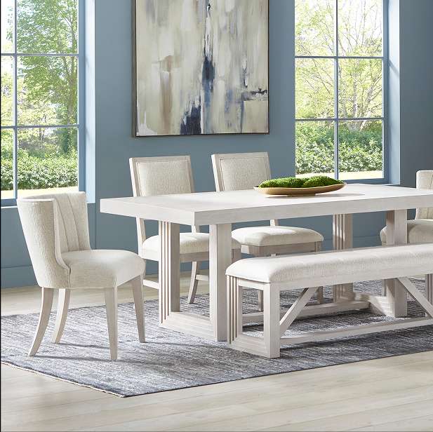 Dining room set with a rectangular table, chairs, and a bench.
