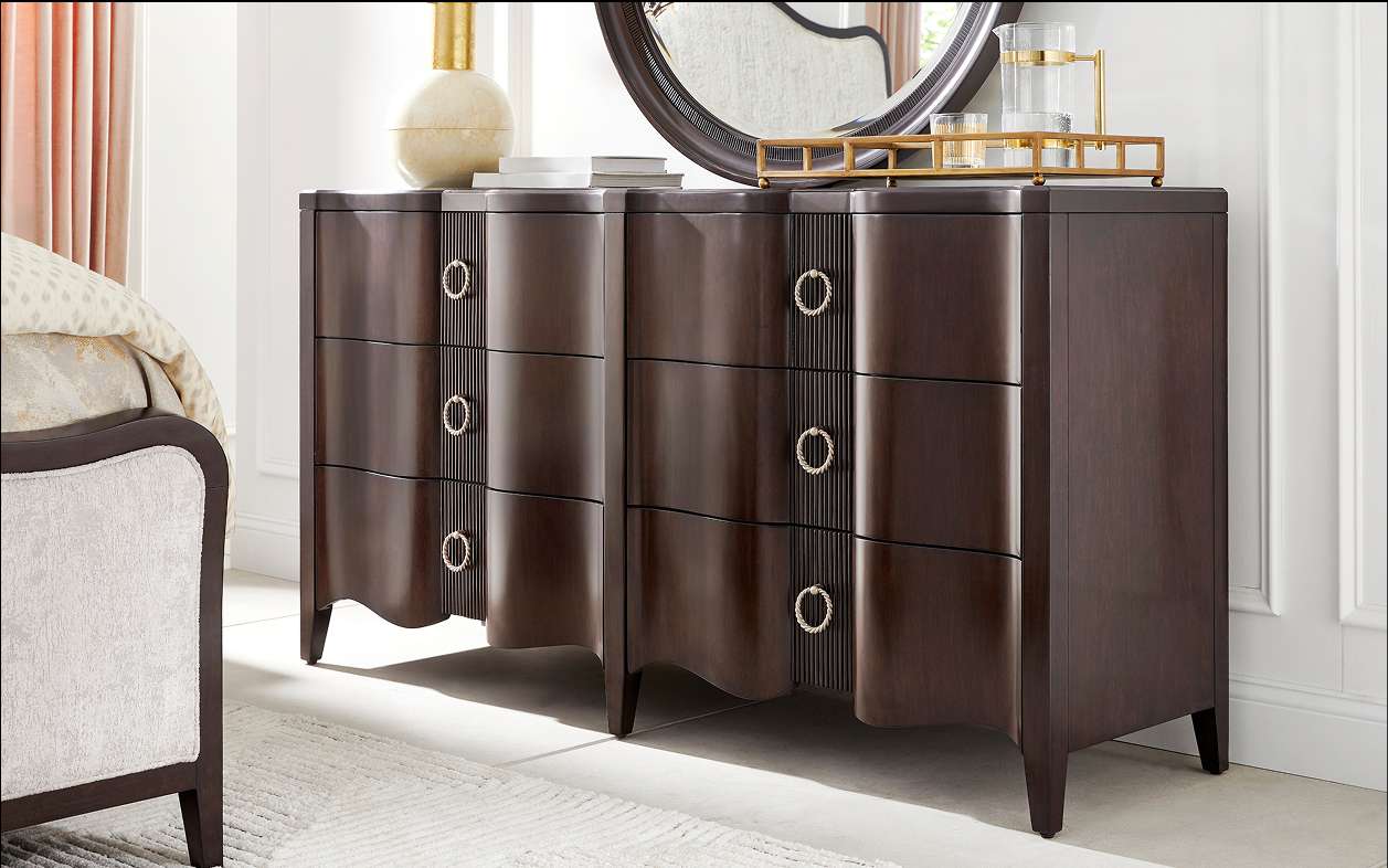 Dark brown dresser with ring pulls.

