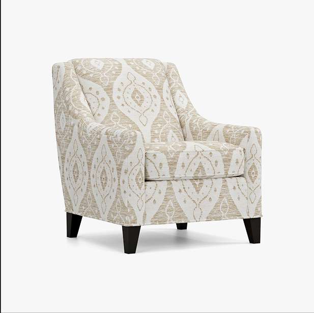 Upholstered armchair with a patterned beige and white fabric, and dark wooden legs.
