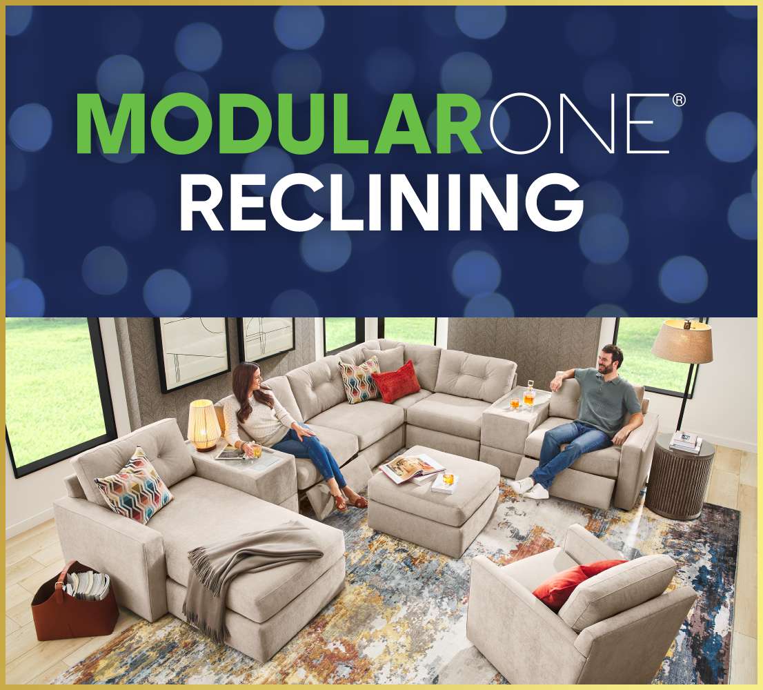 MODULARONE RECLINING. A beige sectional sofa with two people sitting on it.