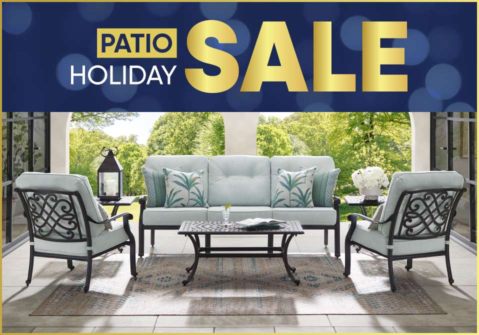 PATIO HOLIDAY SALE. Patio furniture set on a patio.
