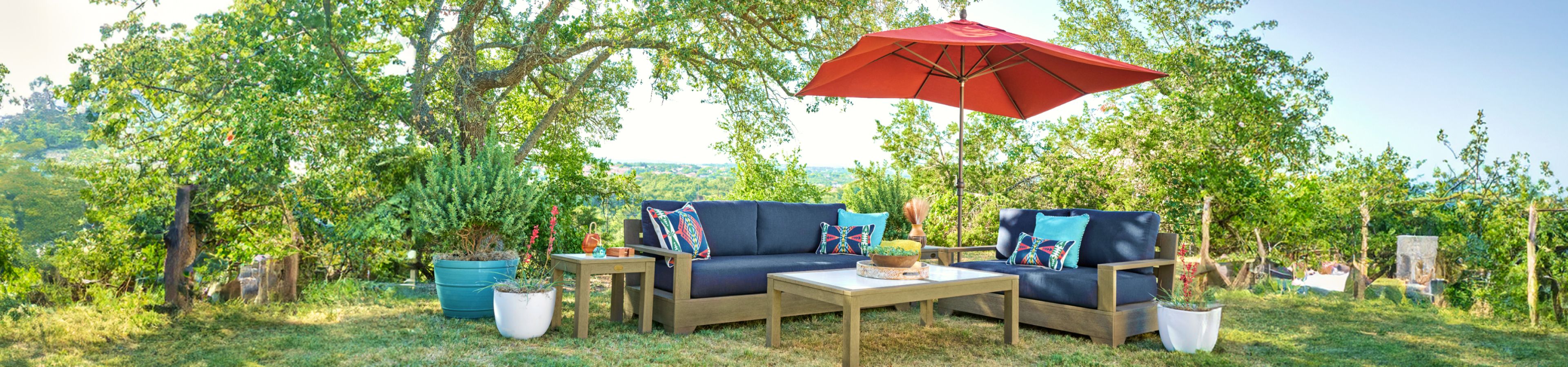 blue patio set with red umbrella