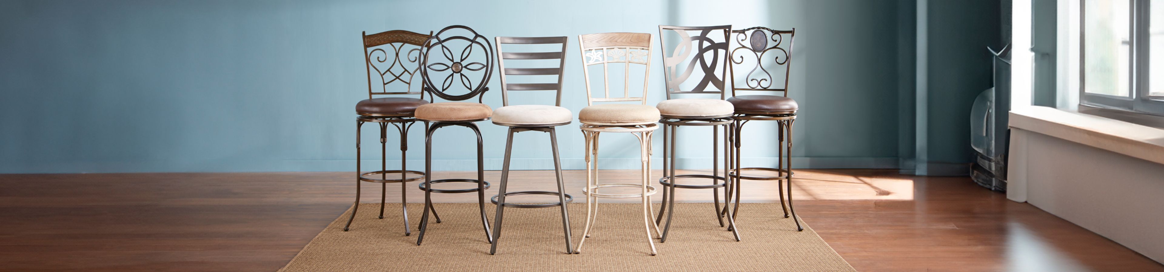 Six bar stools with decorative backs and cushioned seats on a rug.
