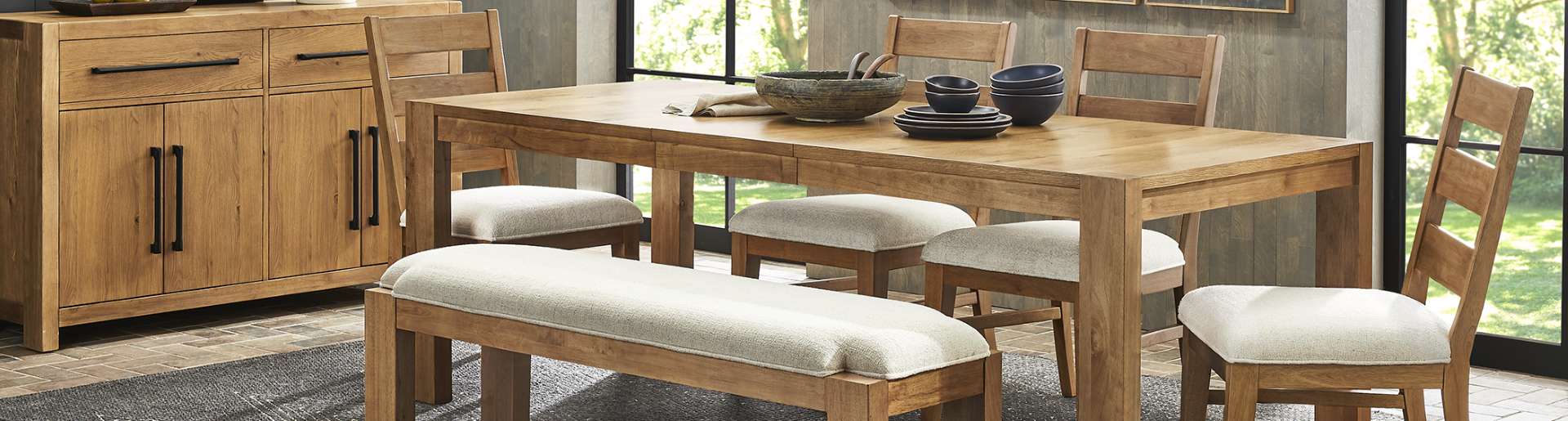 Wooden dining table and chairs with a bench.
