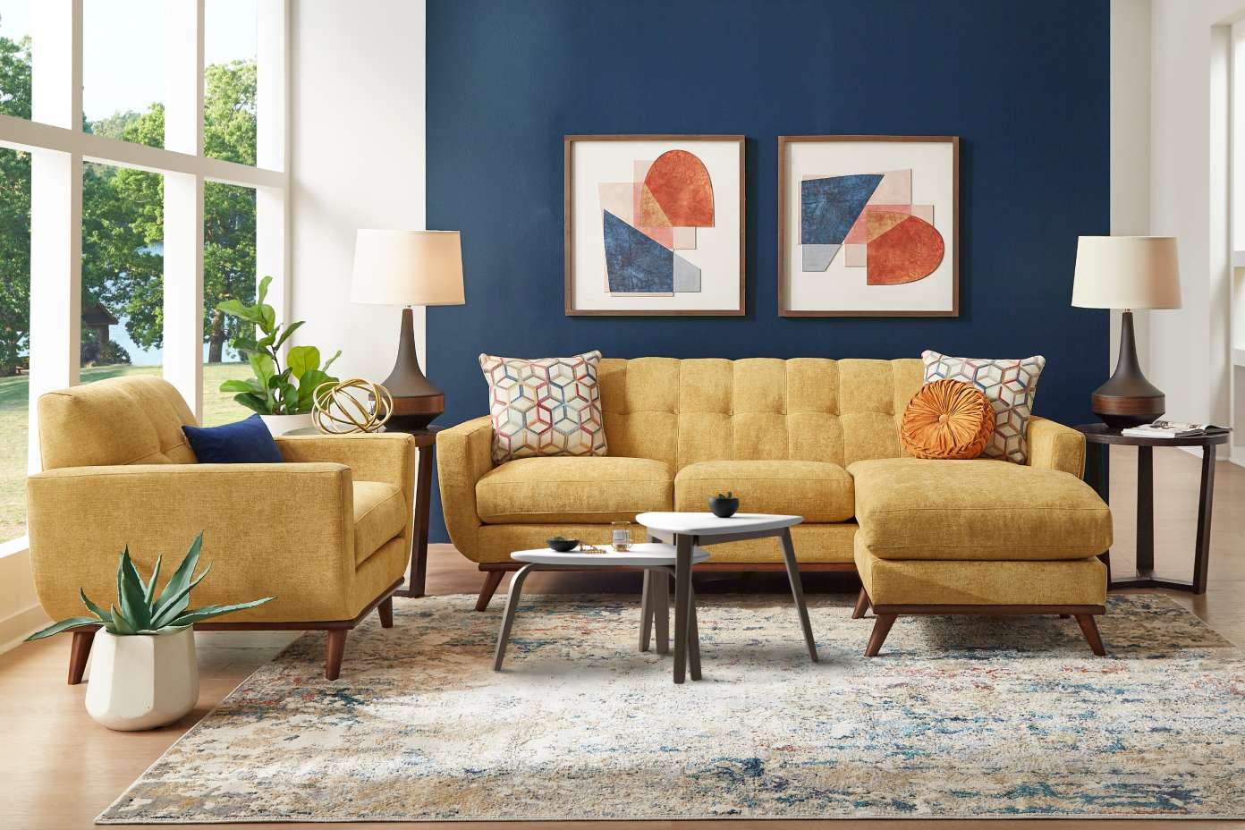 Yellow sectional sofa with matching armchair, rug, and side tables in a living room.
