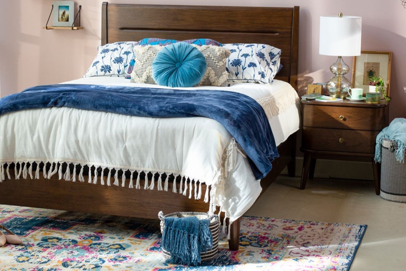 dark brown bedroom set with light bedding