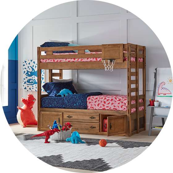 Wooden bunk bed with dinosaur-themed bedding and toys.
