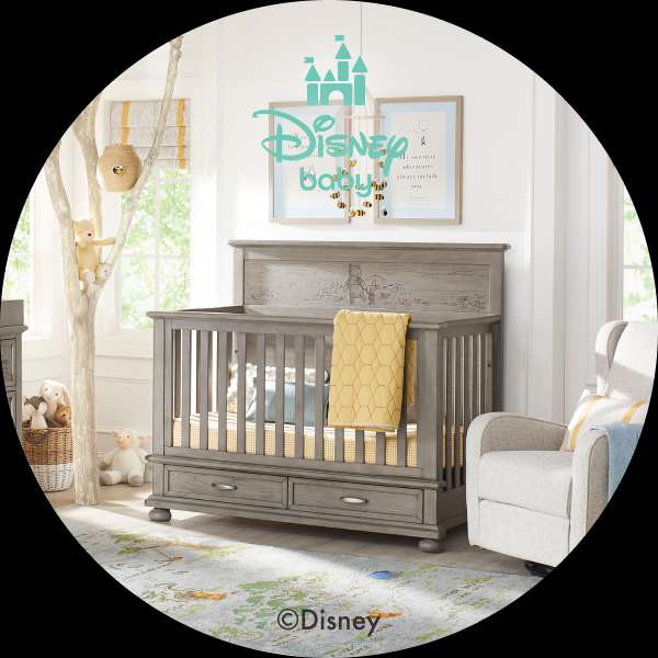 Disney baby crib with Winnie the Pooh theme.
