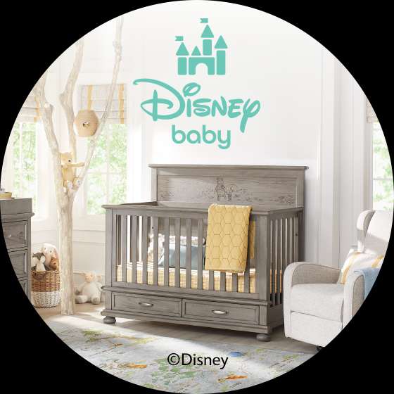 Disney baby nursery with crib, dresser, and rocking chair.
