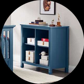 Blue bookcase with shelves, holding boxes and decor.
