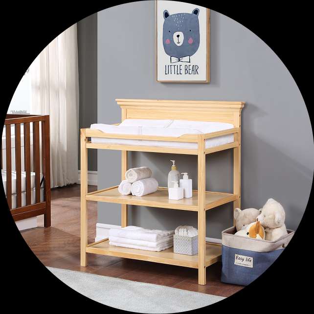 Wooden baby changing table with shelves.
