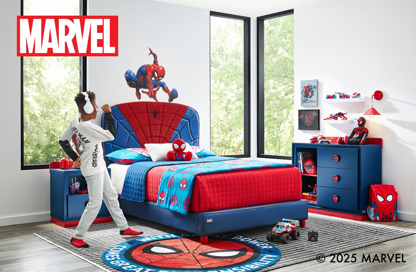 MARVEL. A child's bedroom with Spider-Man themed furniture and decor.
