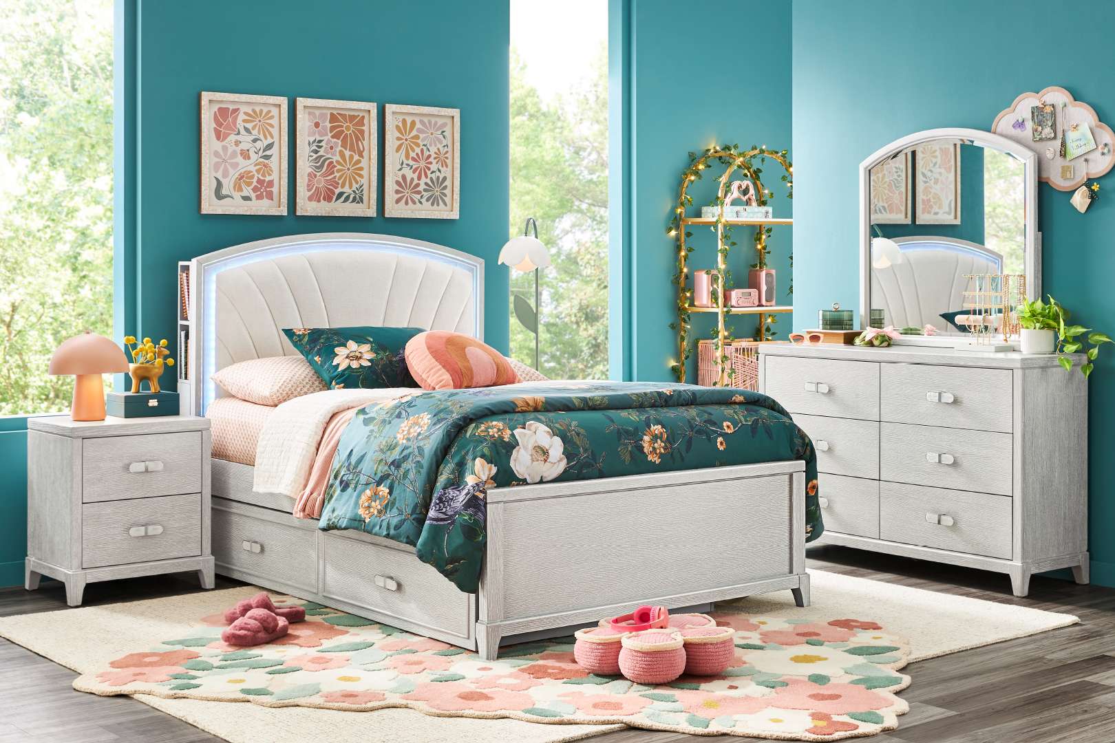 Bedroom furniture set with a bed, dresser, and nightstand.
