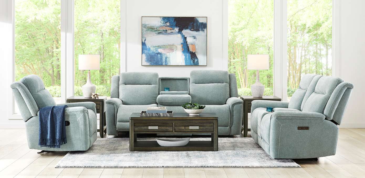Living room furniture set with a sofa, two recliners, and a coffee table.
