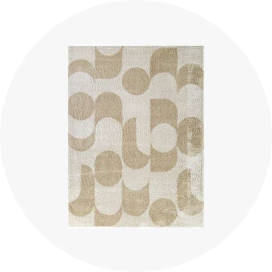 Beige and white geometric patterned rug.

