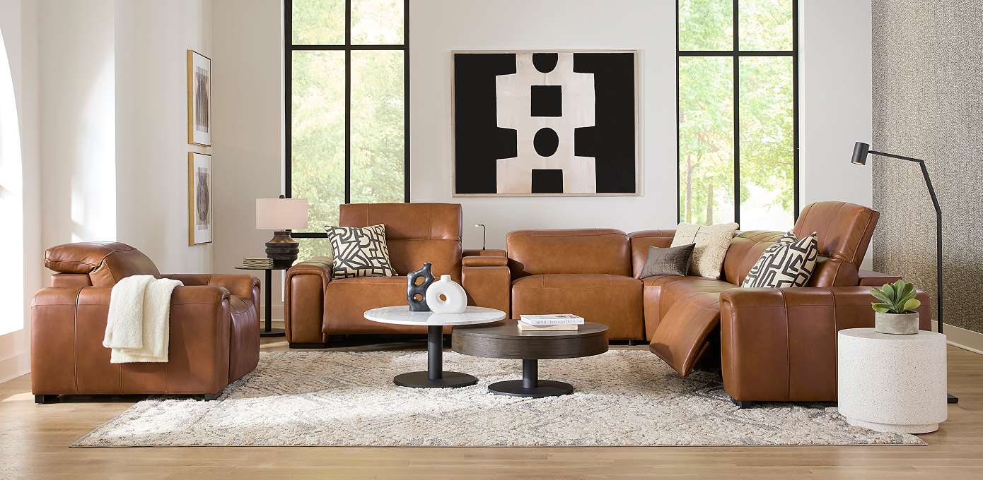 Brown leather sectional sofa in a living room.
