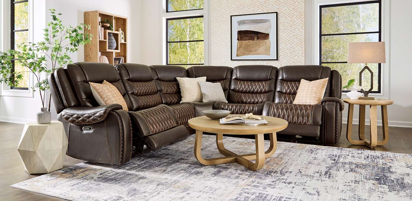 Brown leather sectional sofa in a living room.
