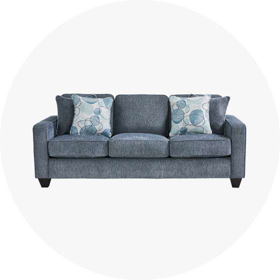 Blue sofa with two decorative pillows.
