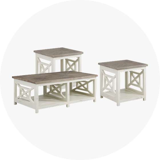 Three-piece coffee table set with white frames and gray tops.
