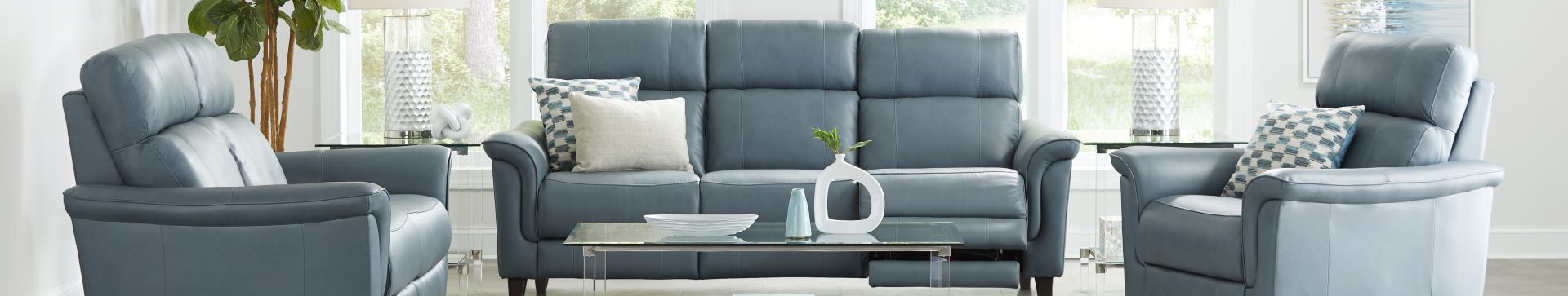 Blue leather sofa and armchairs.
