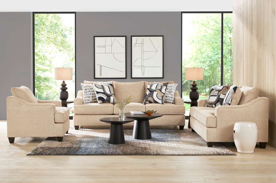 Living room furniture set with a sofa, two armchairs, and a rug.
