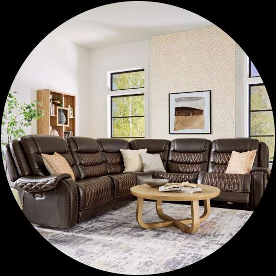 Brown leather sectional sofa in a living room.
