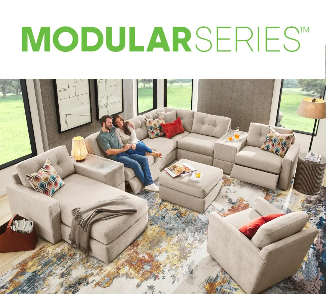 MODULARSERIES™ A modular sectional sofa with a couple sitting on it.
