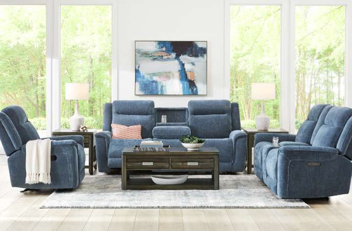 Blue reclining sofa set in a living room.
