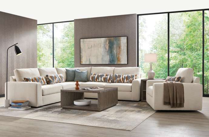 Living room with a sectional sofa, armchair, coffee table, and rug.
