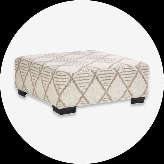 Square ottoman with diamond pattern fabric and black feet.
