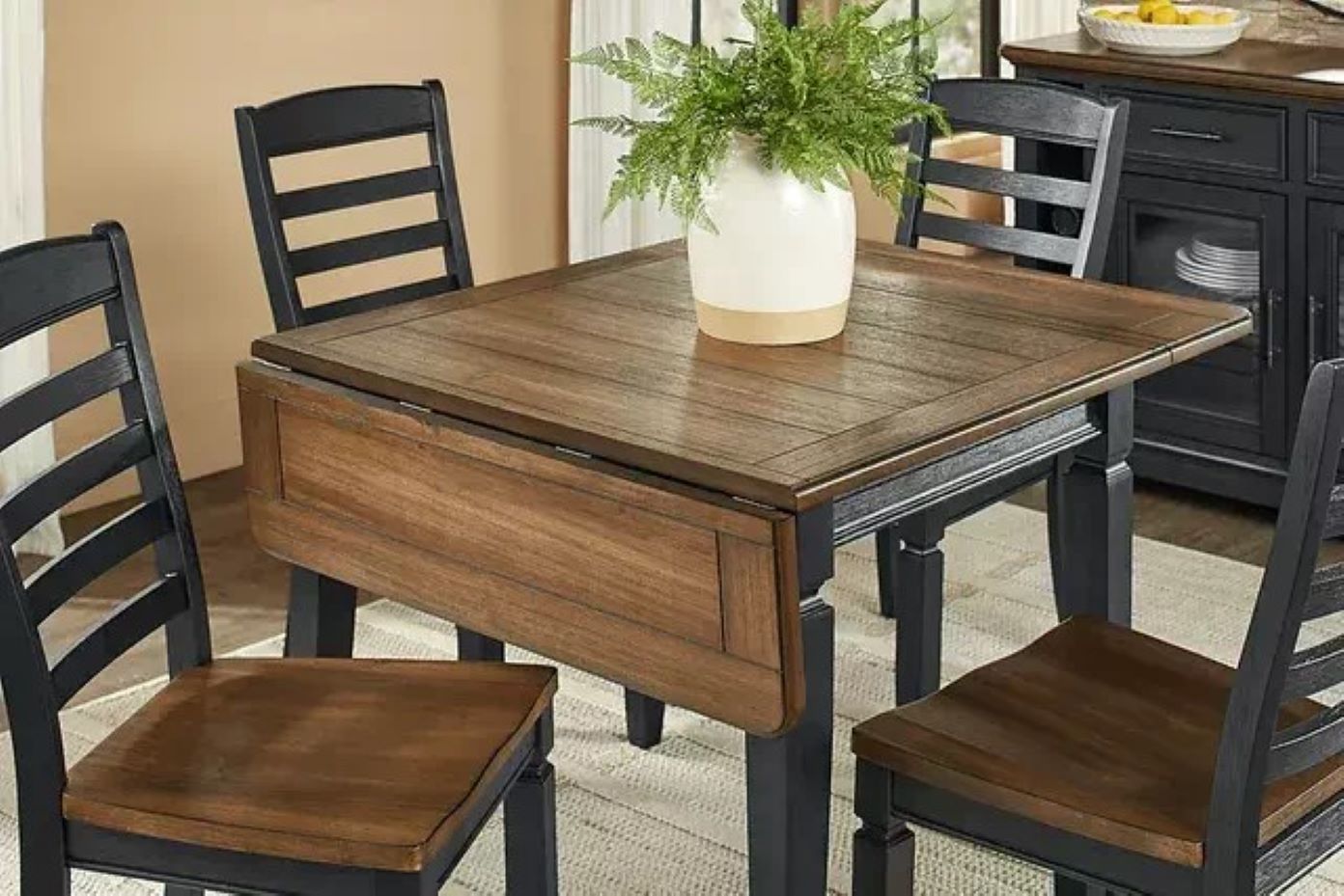 Dining table with drop leaf and chairs.
