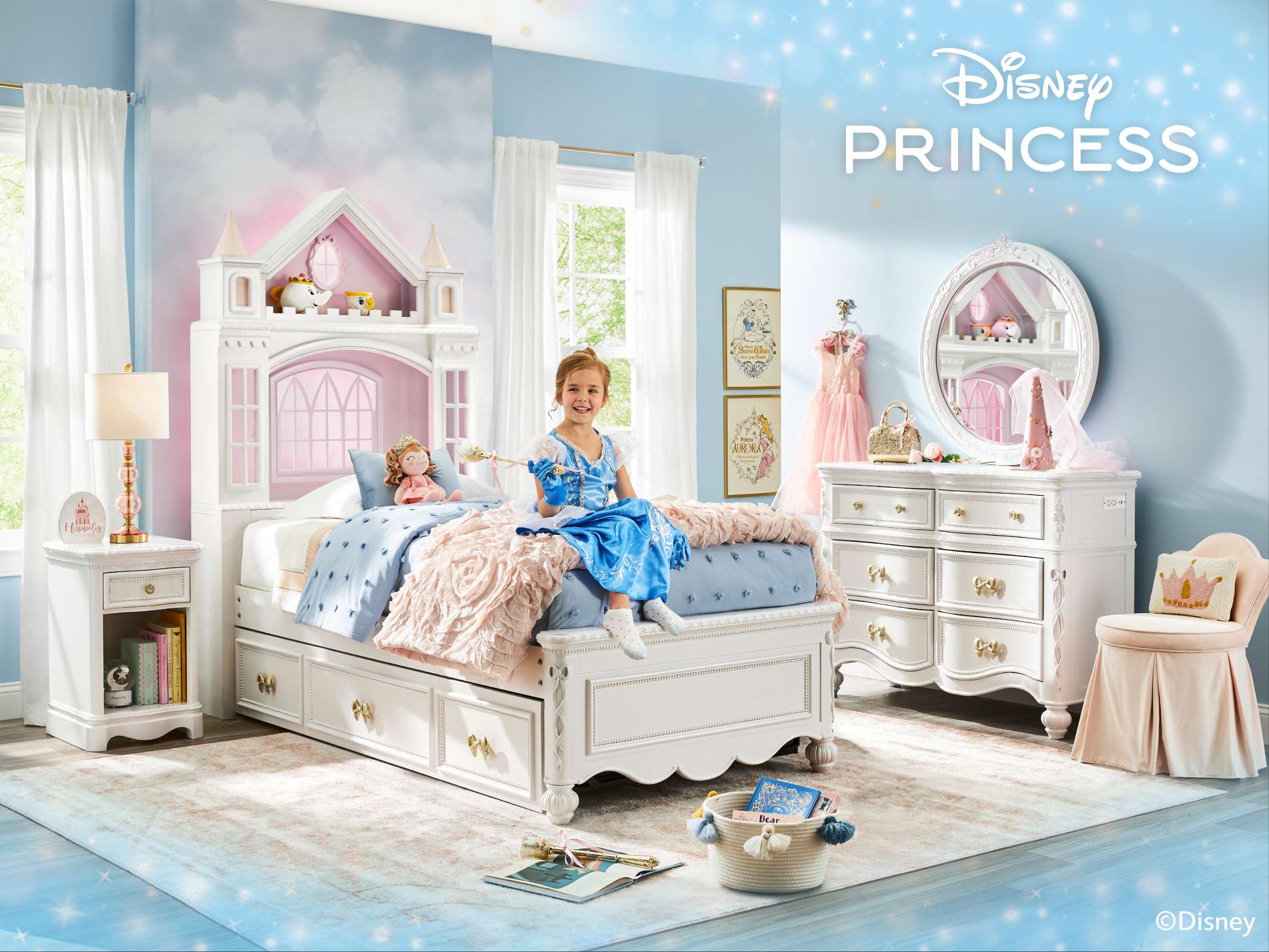 Disney Princess. A girl in a princess dress sits on a white bed in a princess-themed bedroom.
