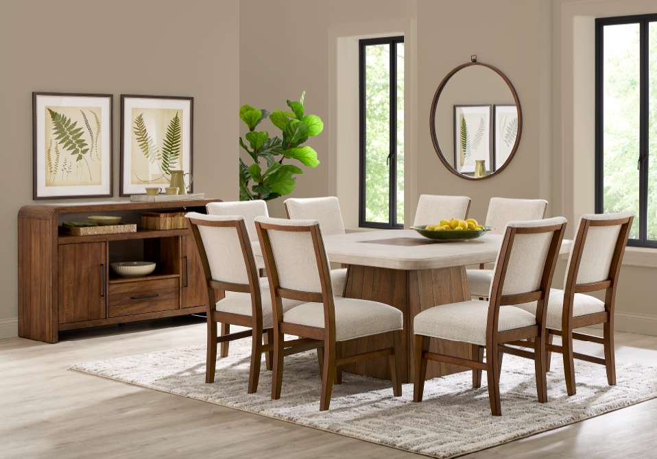 Dining room with a wooden table, chairs, and a sideboard.
