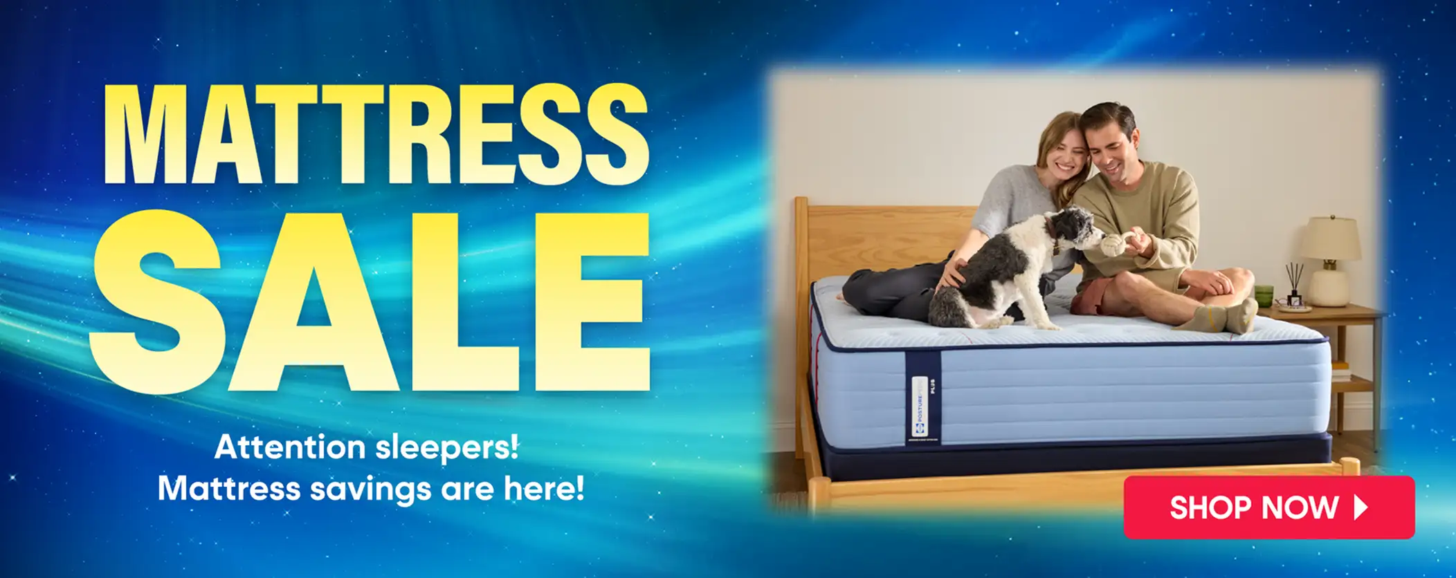 MATTRESS SALE. Shop Now. A couple and a dog on a mattress.
