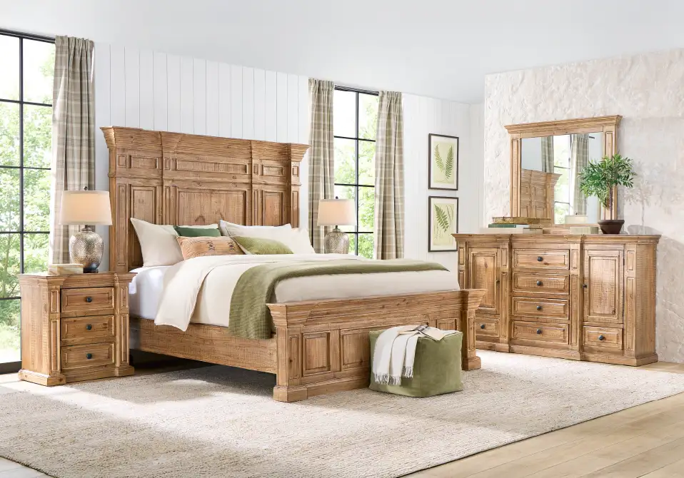 Bedroom furniture set with a bed, nightstand, dresser, and mirror.
