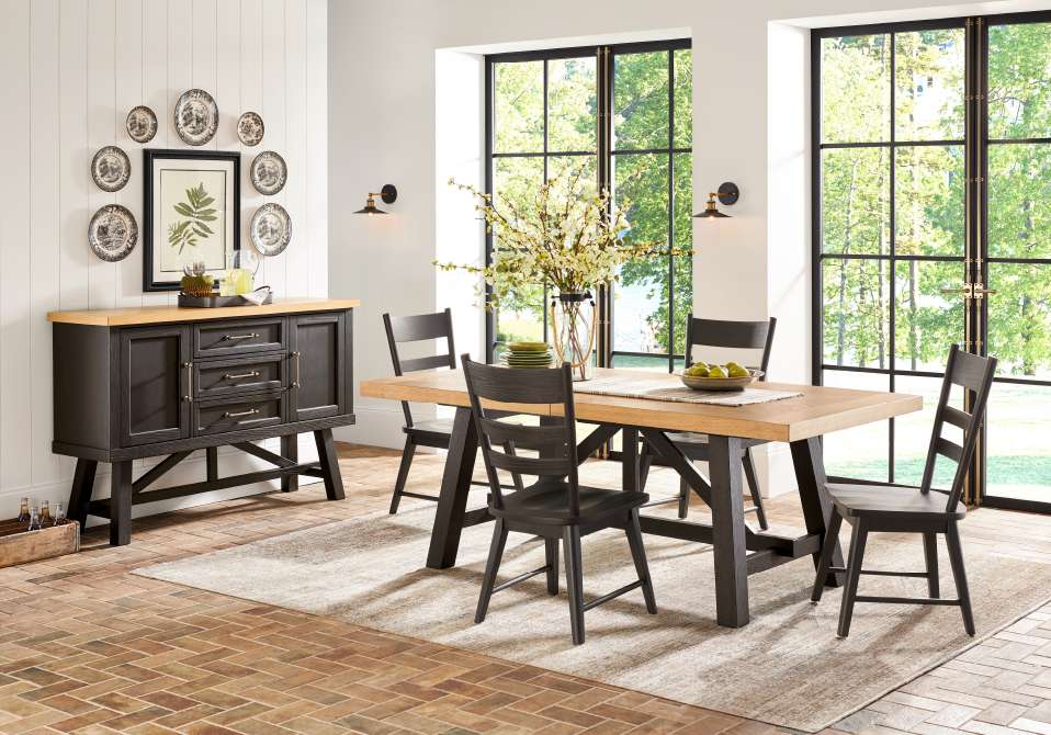 Dining room with a wooden table, chairs, and a buffet.

