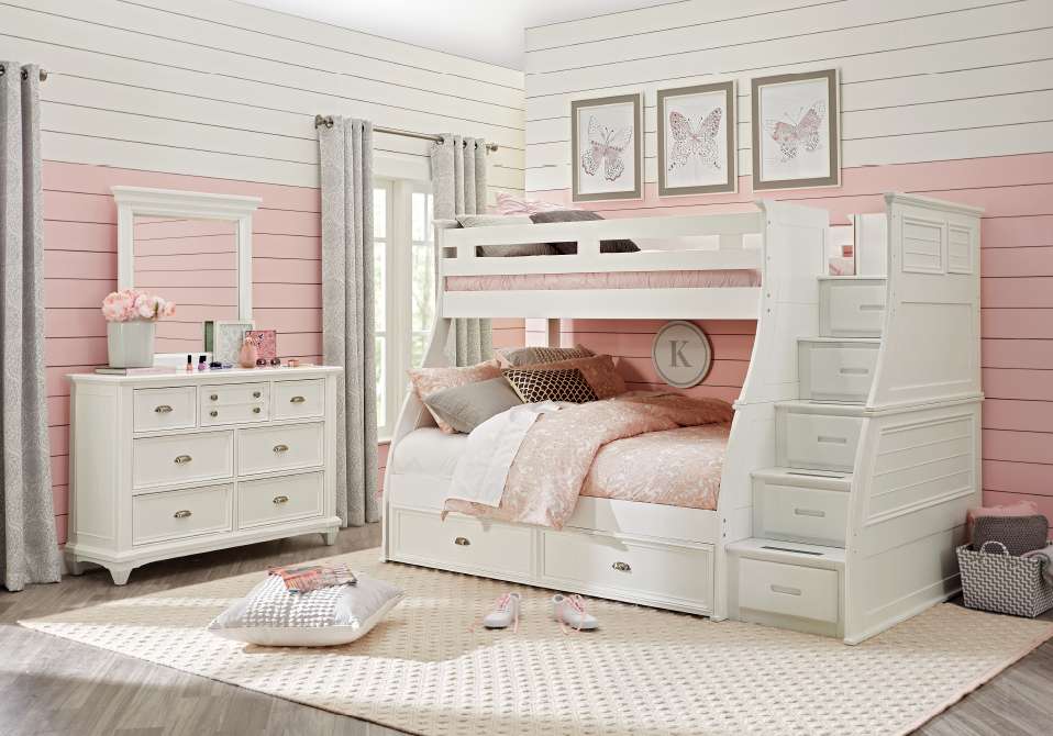 White bunk bed in a pink and white bedroom.