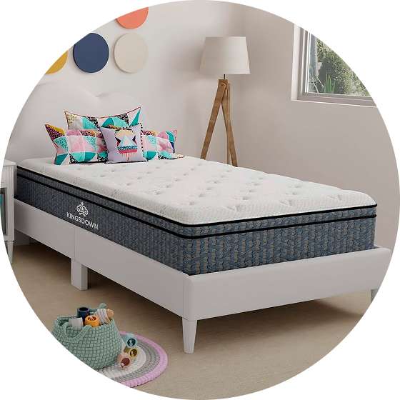 Kingsdown mattress on a white bed frame.
