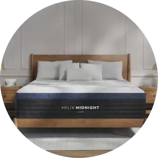 Helix Midnight Luxe mattress on a wooden bed frame.
