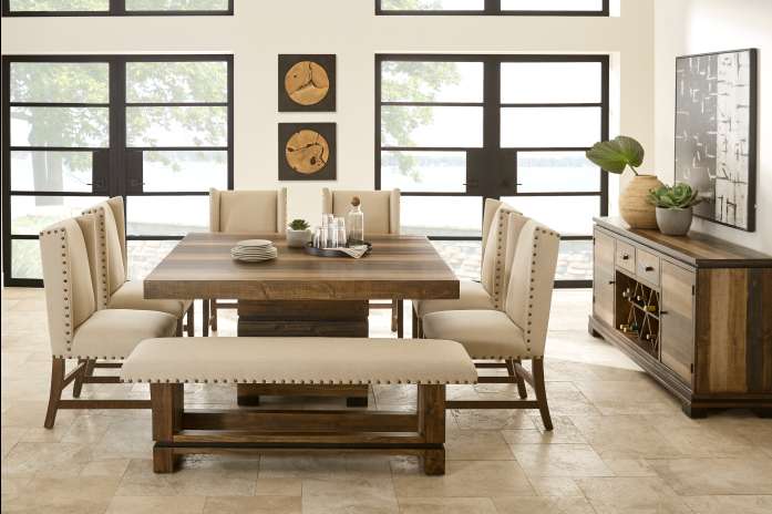 Dining room set with a square wooden table, chairs, and a bench.
