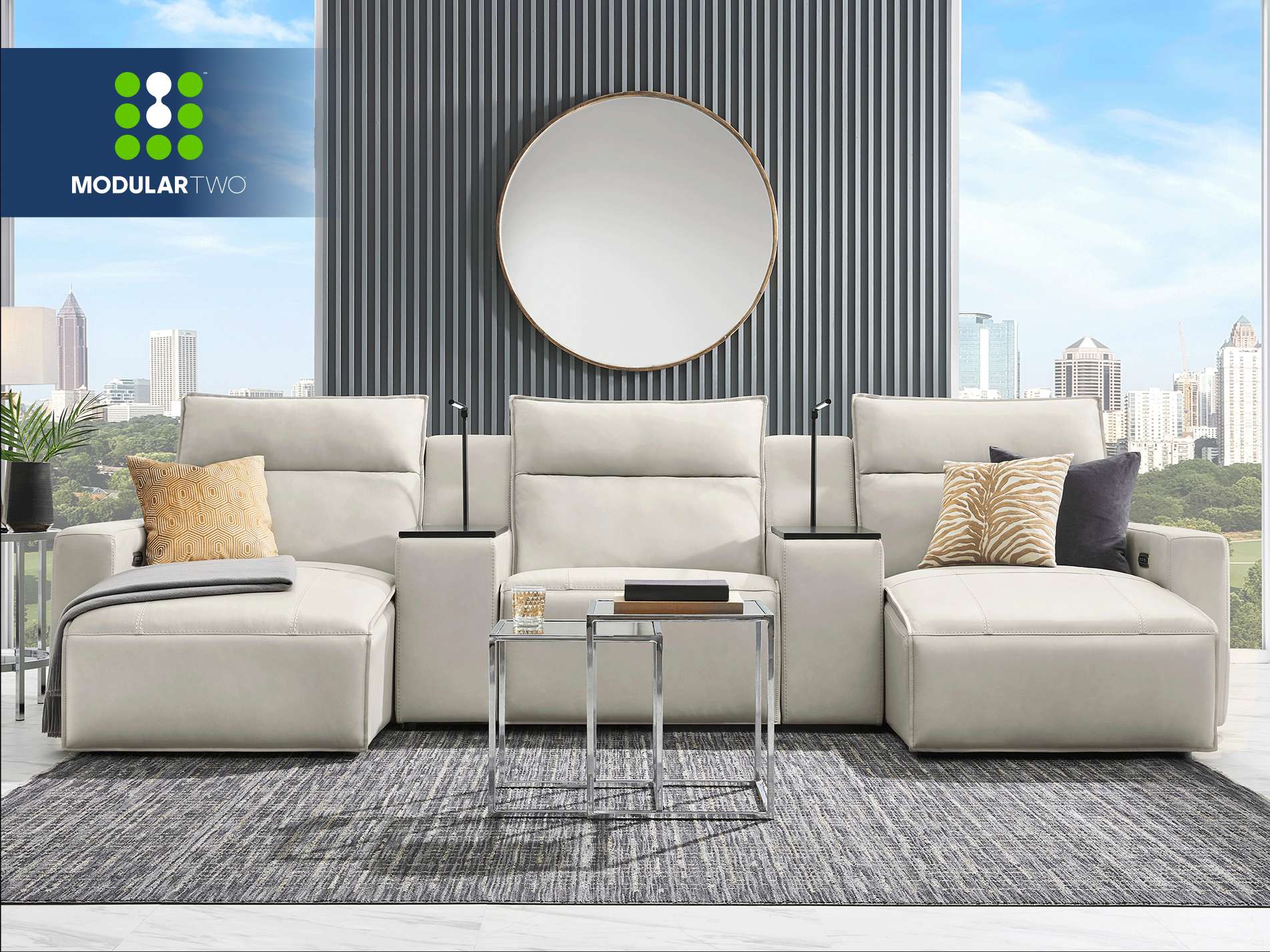 MODULAR TWO. A modern white sectional sofa with a city view.
