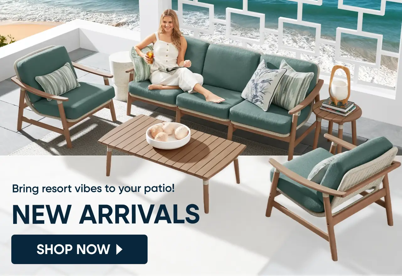 Bring resort vibes to your patio! NEW ARRIVALS. A woman relaxes on a teal outdoor sofa set on a sunny patio.