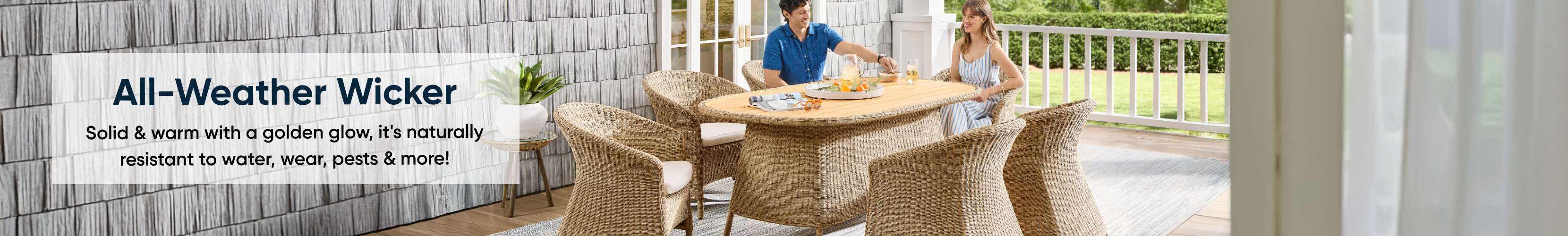 All-Weather Wicker. Outdoor dining set with a couple.