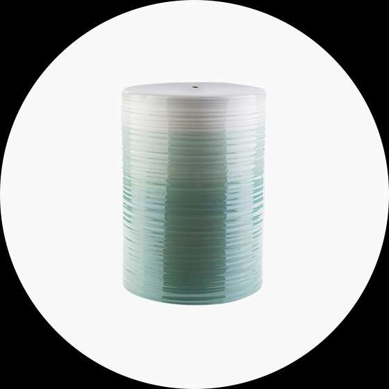 A cylindrical salt shaker with a gradient of white to teal.
