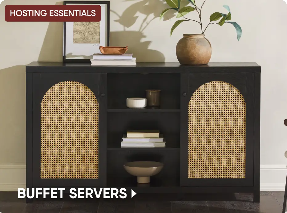 HOSTING ESSENTIALS BUFFET SERVERS. A black wooden buffet cabinet with arched cane doors and open center shelving.
